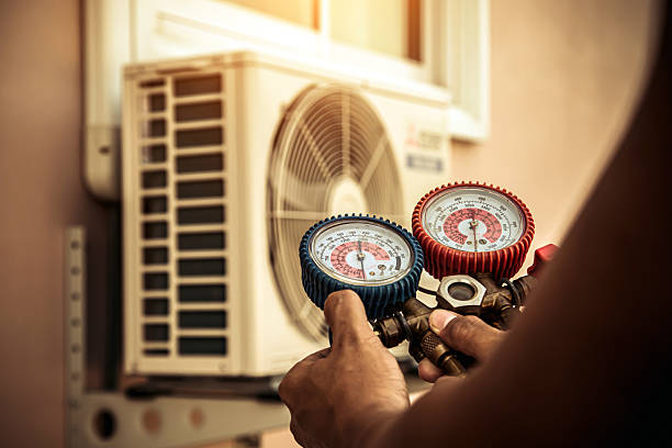 Professional Hvac technician working in Essex, MO